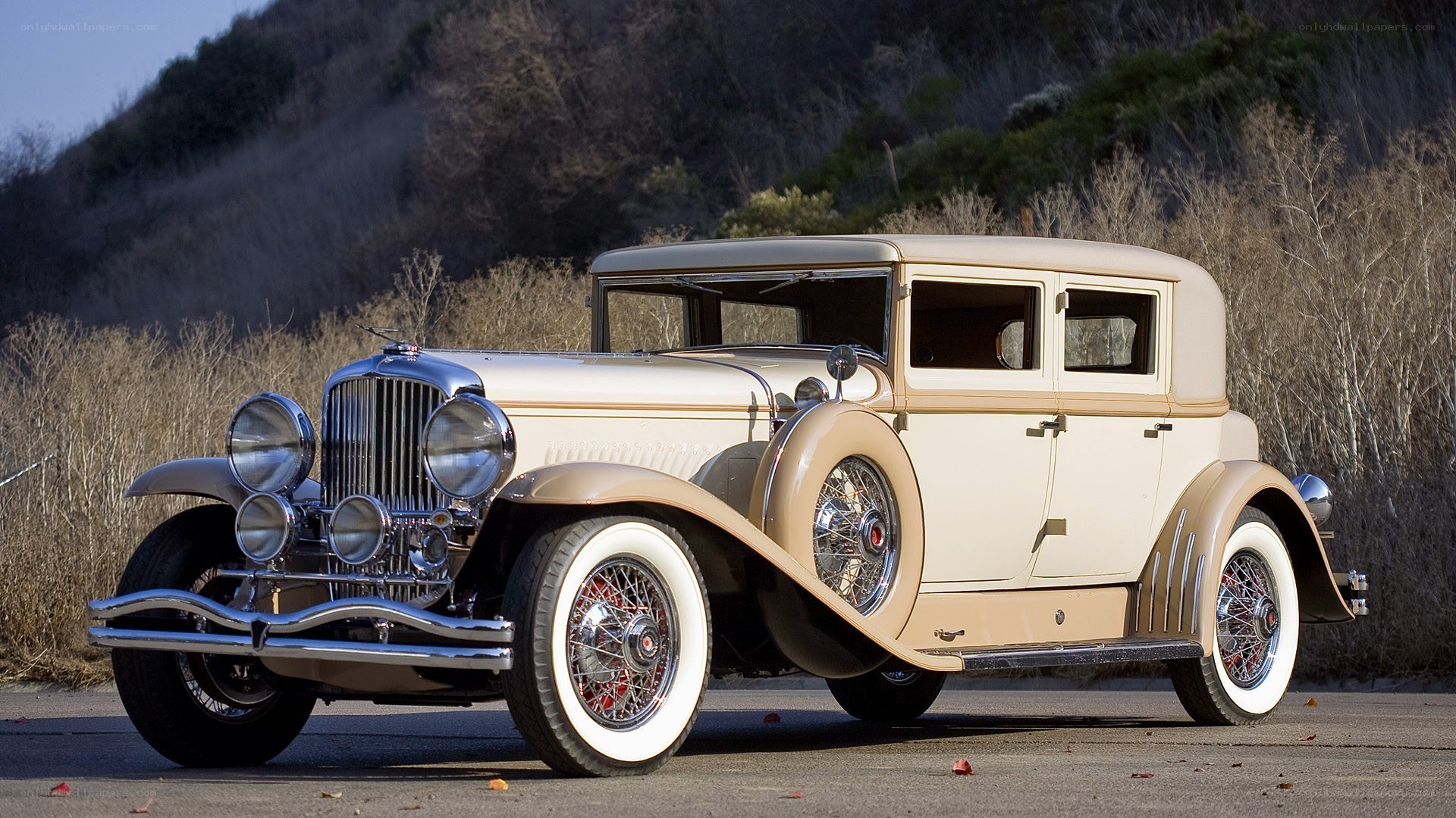 Classic cream car on road