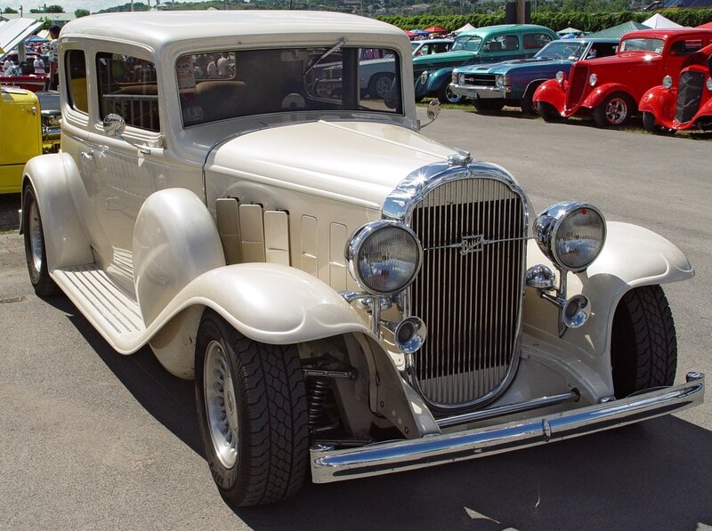 Classic cream-colored car at a show