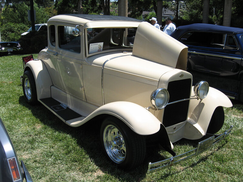 Classic cream-colored car on display
