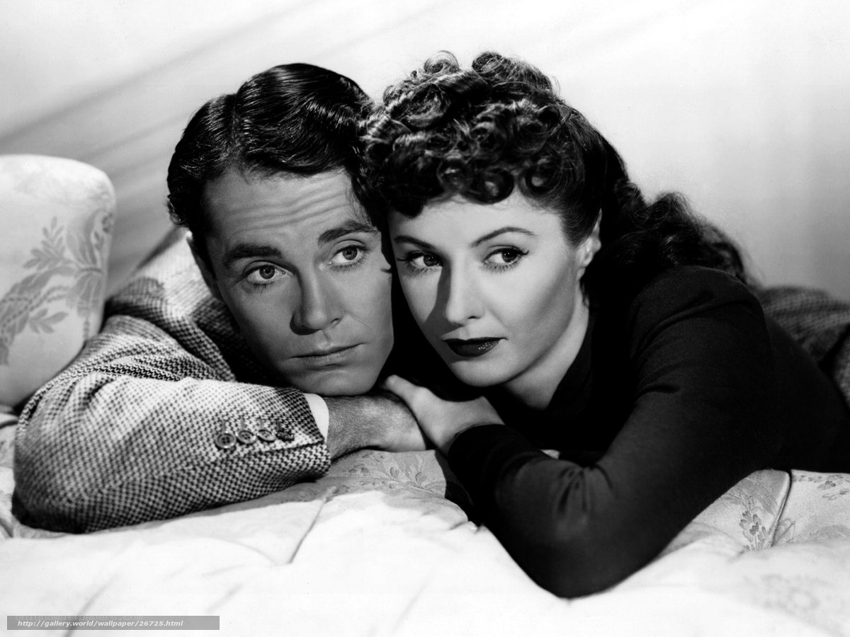 Classic film couple on bed