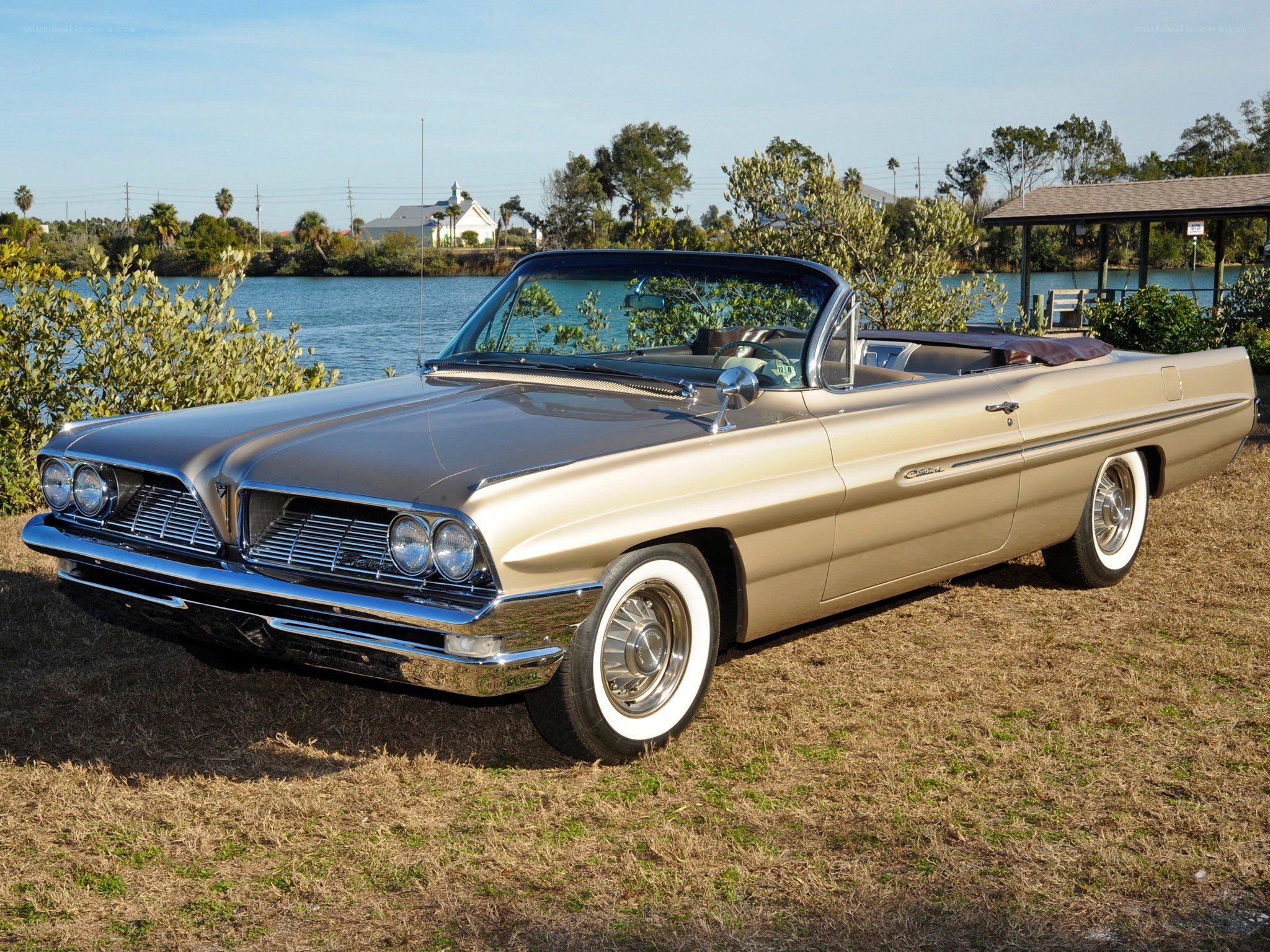 Classic gold convertible by the water