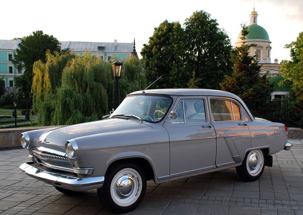 Classic gray sedan in city park
