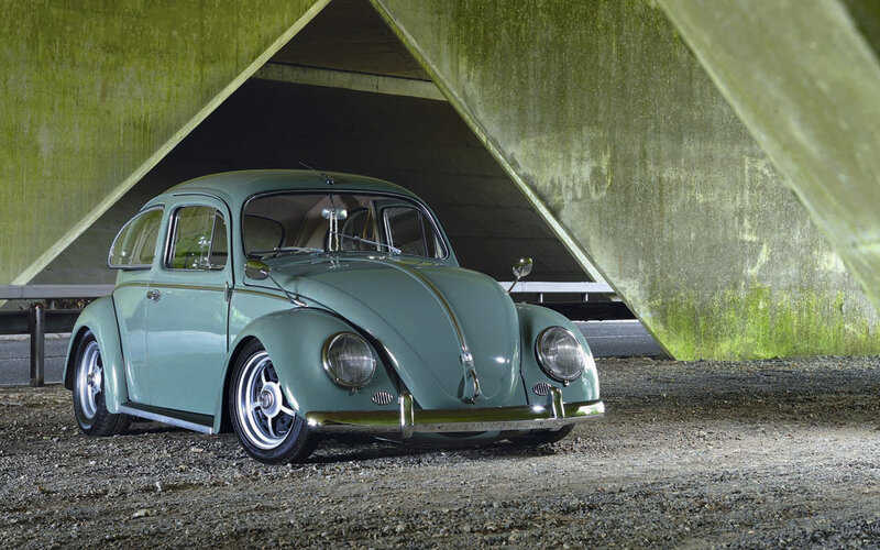 Classic green Beetle under bridge