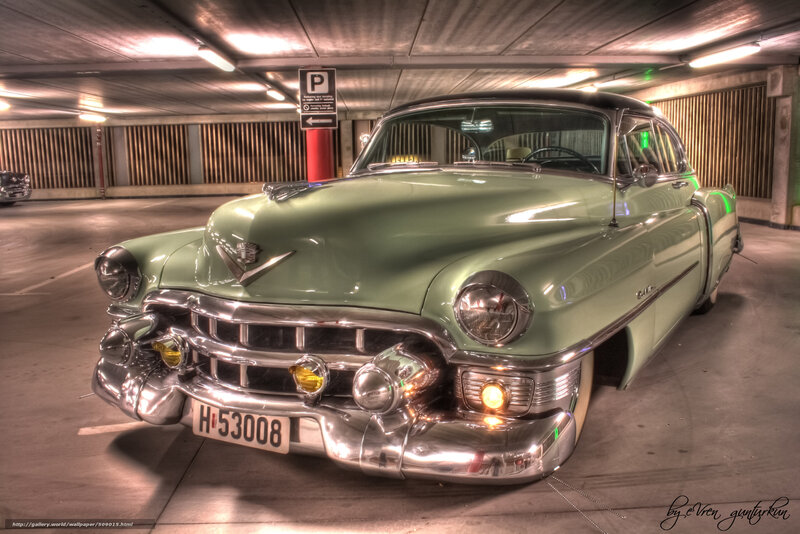 Classic green Cadillac in garage