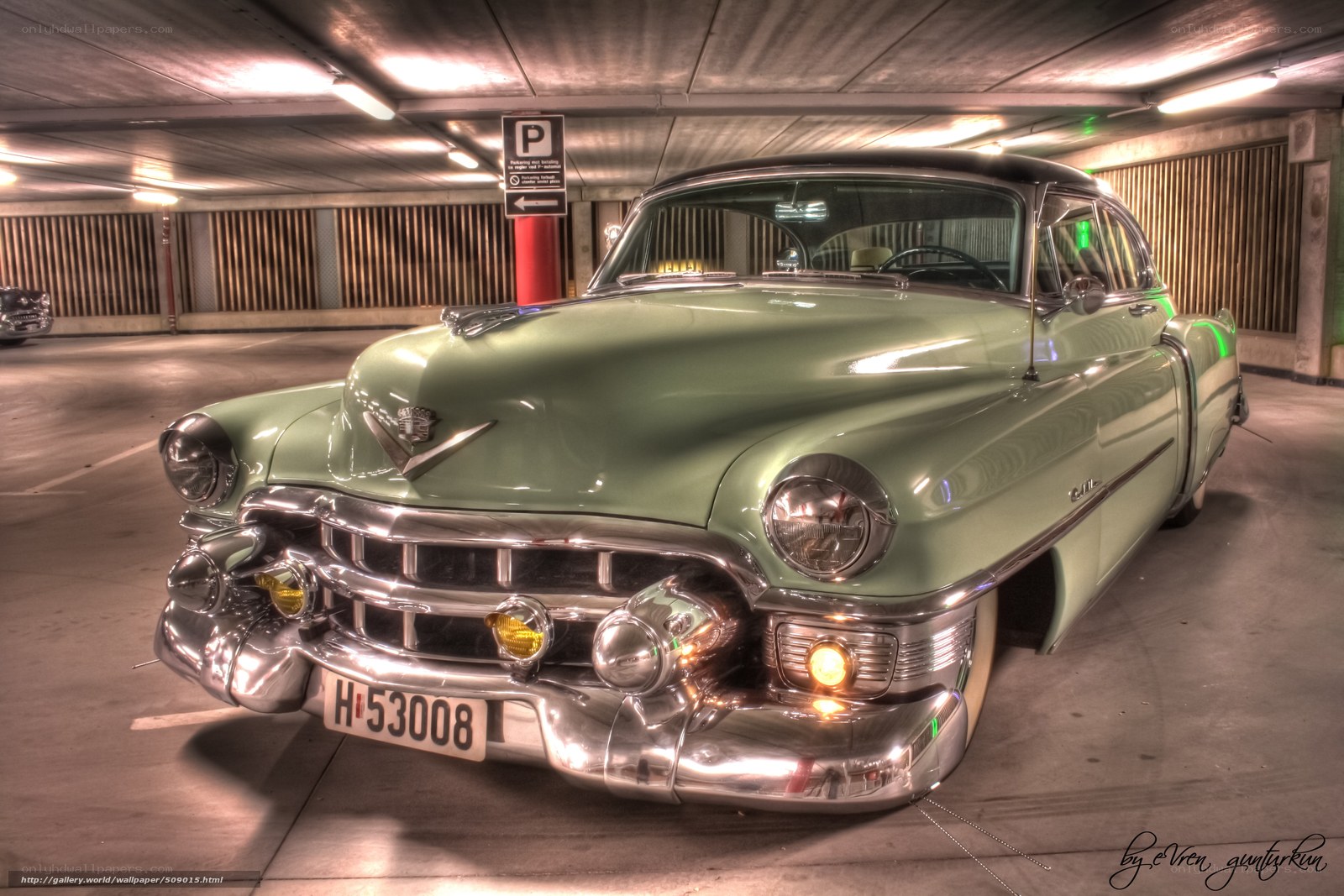 Classic green Cadillac in garage
