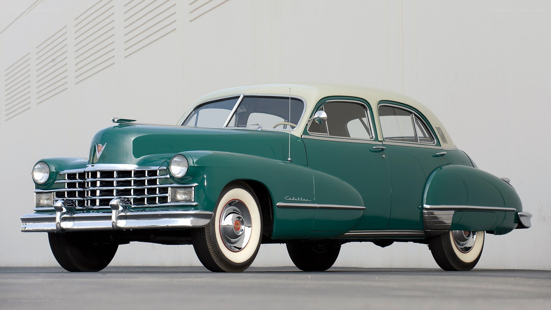Classic green Cadillac sedan