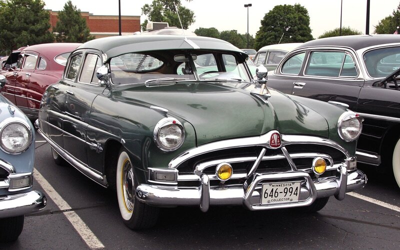 Classic green car at a show