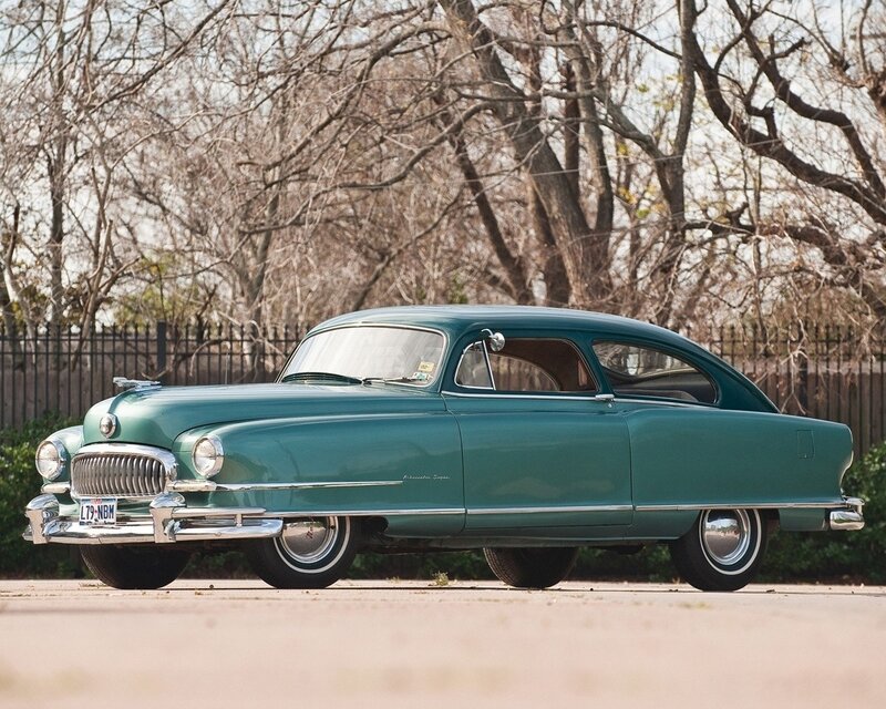 Classic green car in a park