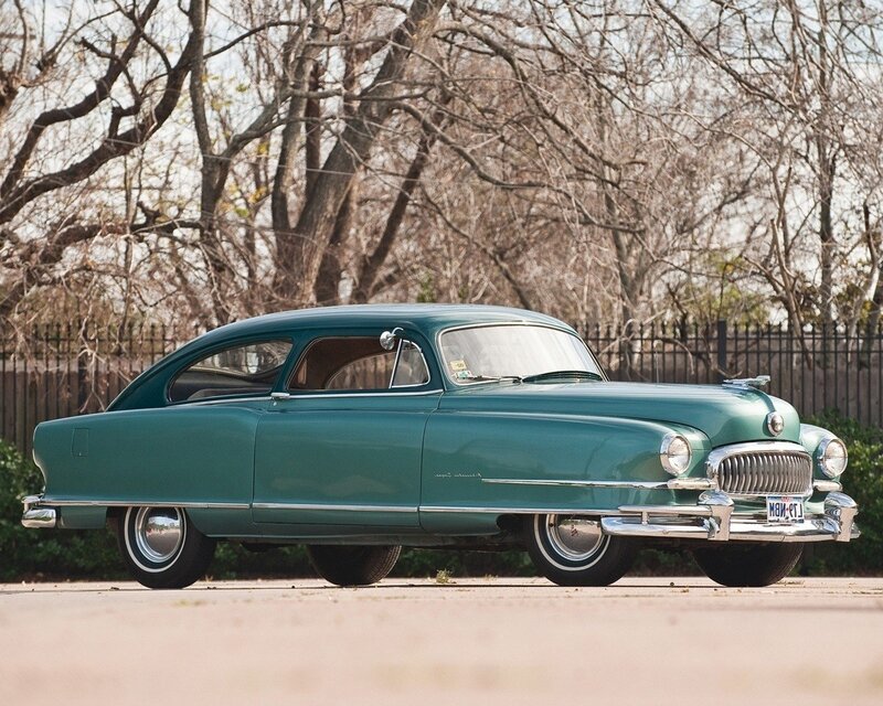Classic green car in park