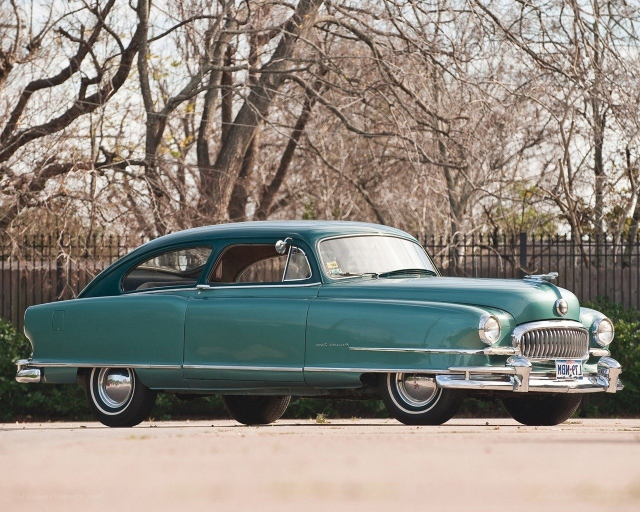 Classic green car in park
