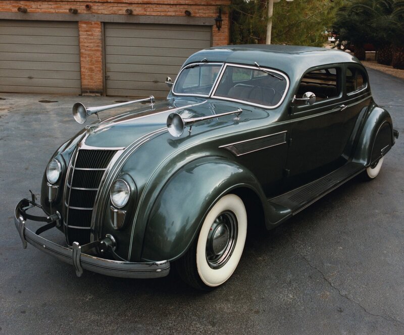Classic green car with horns