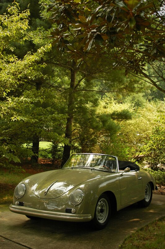 Classic green convertible in garden
