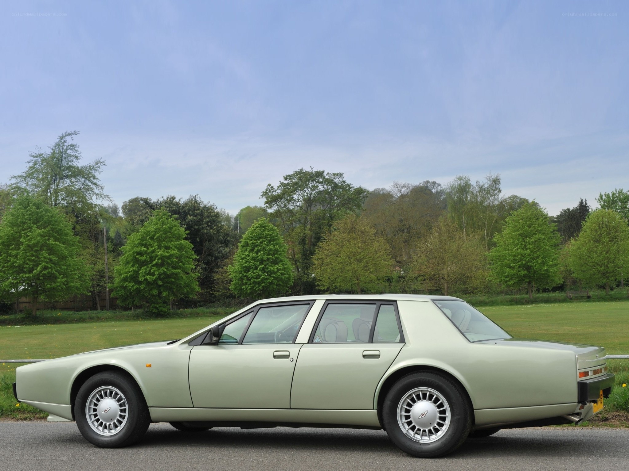 Classic green sedan on a road
