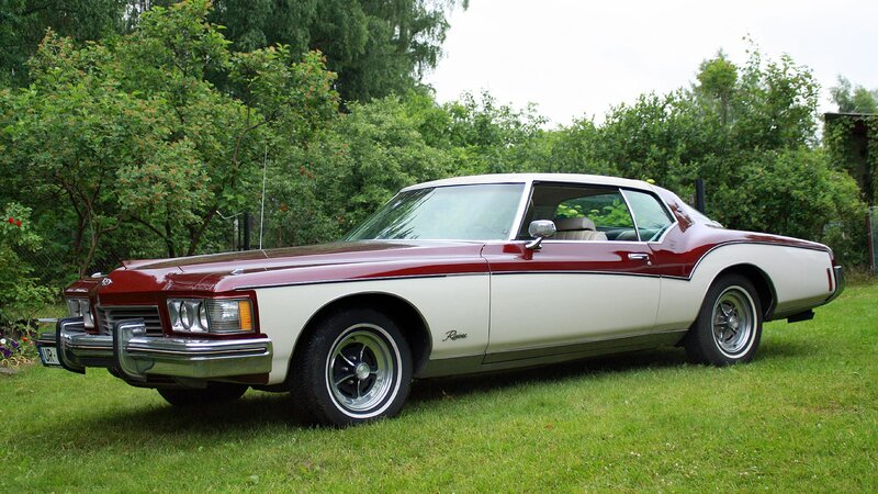 Classic maroon and white Buick Riviera
