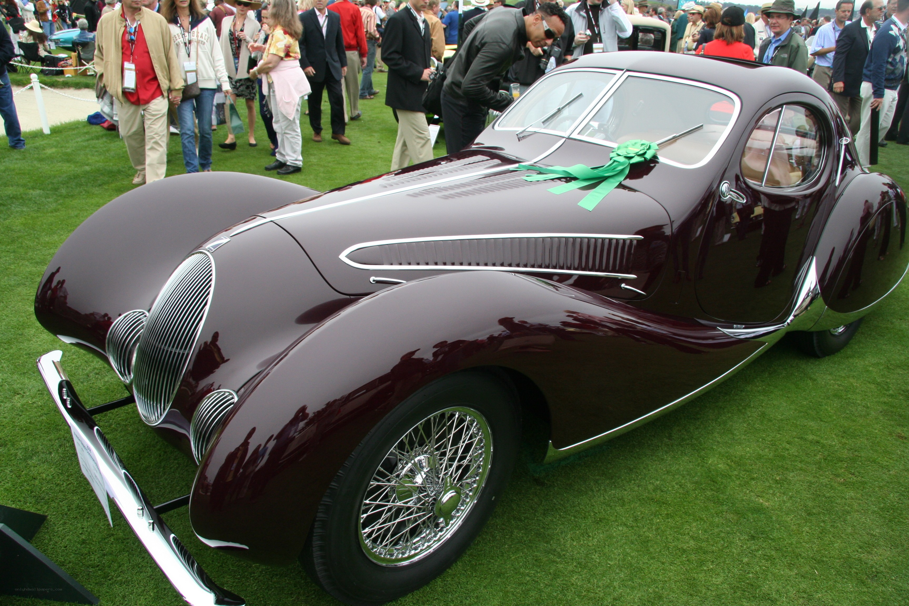 Classic maroon car on display