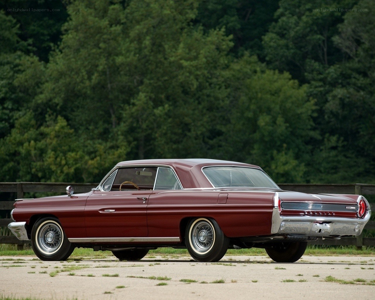 Classic maroon Pontiac car