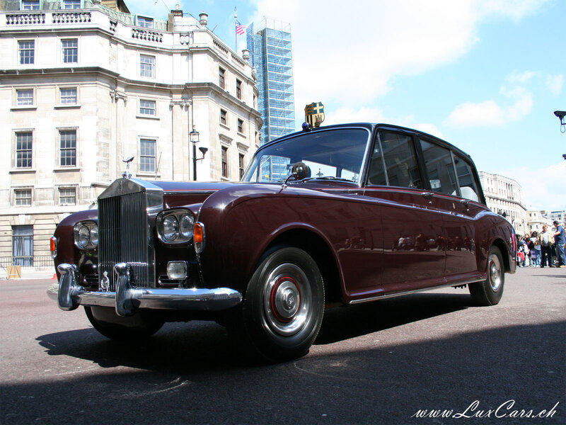 Classic maroon Rolls-Royce on display