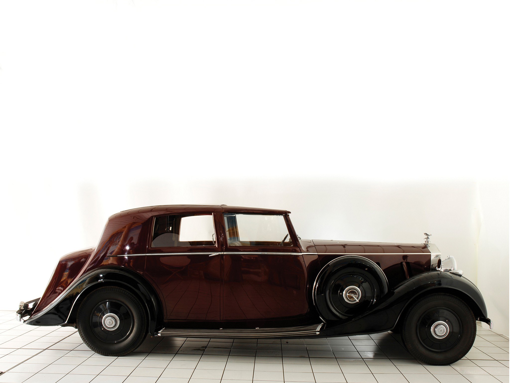 Classic maroon Rolls-Royce sedan