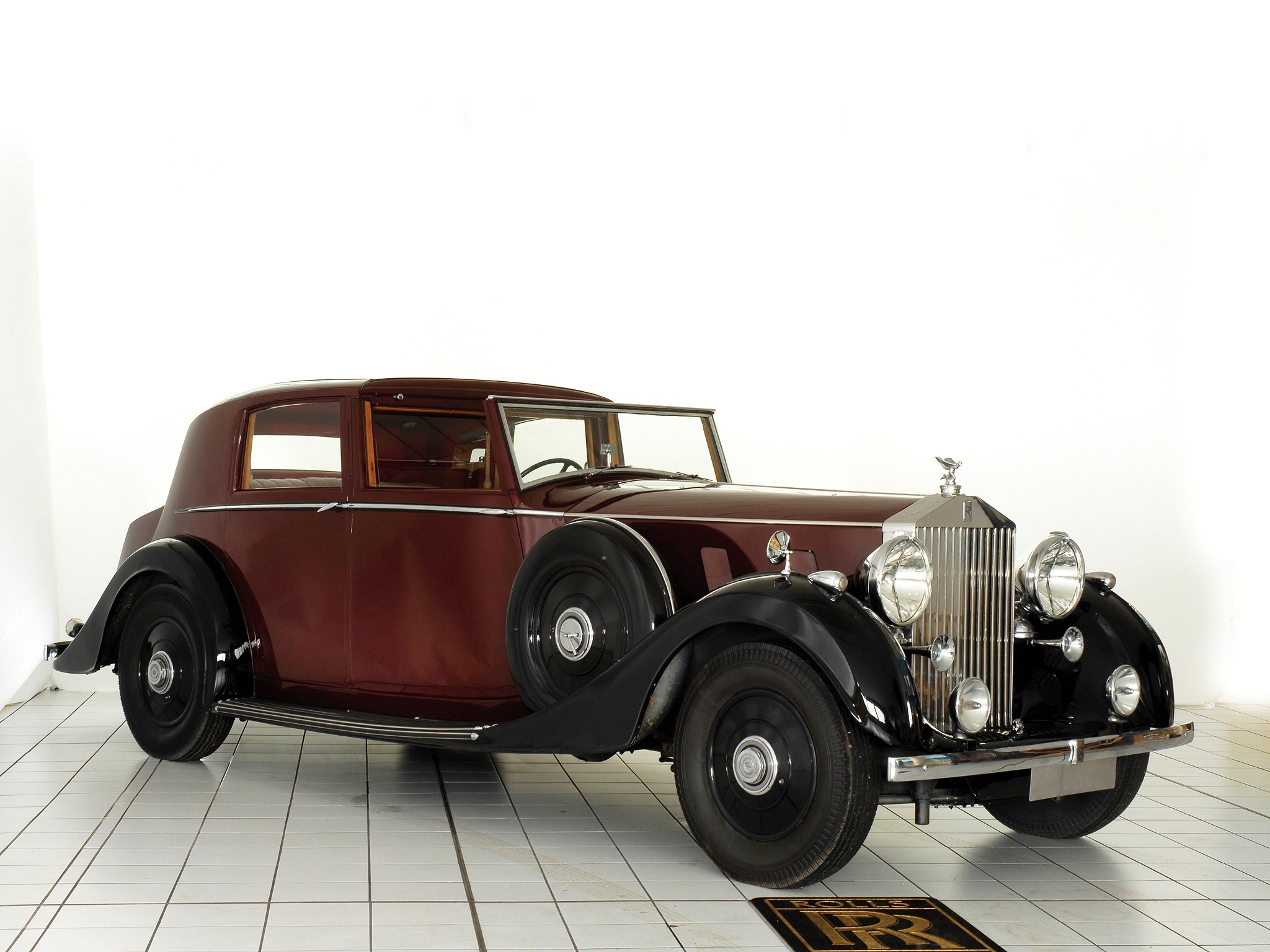 Classic maroon Rolls-Royce sedan