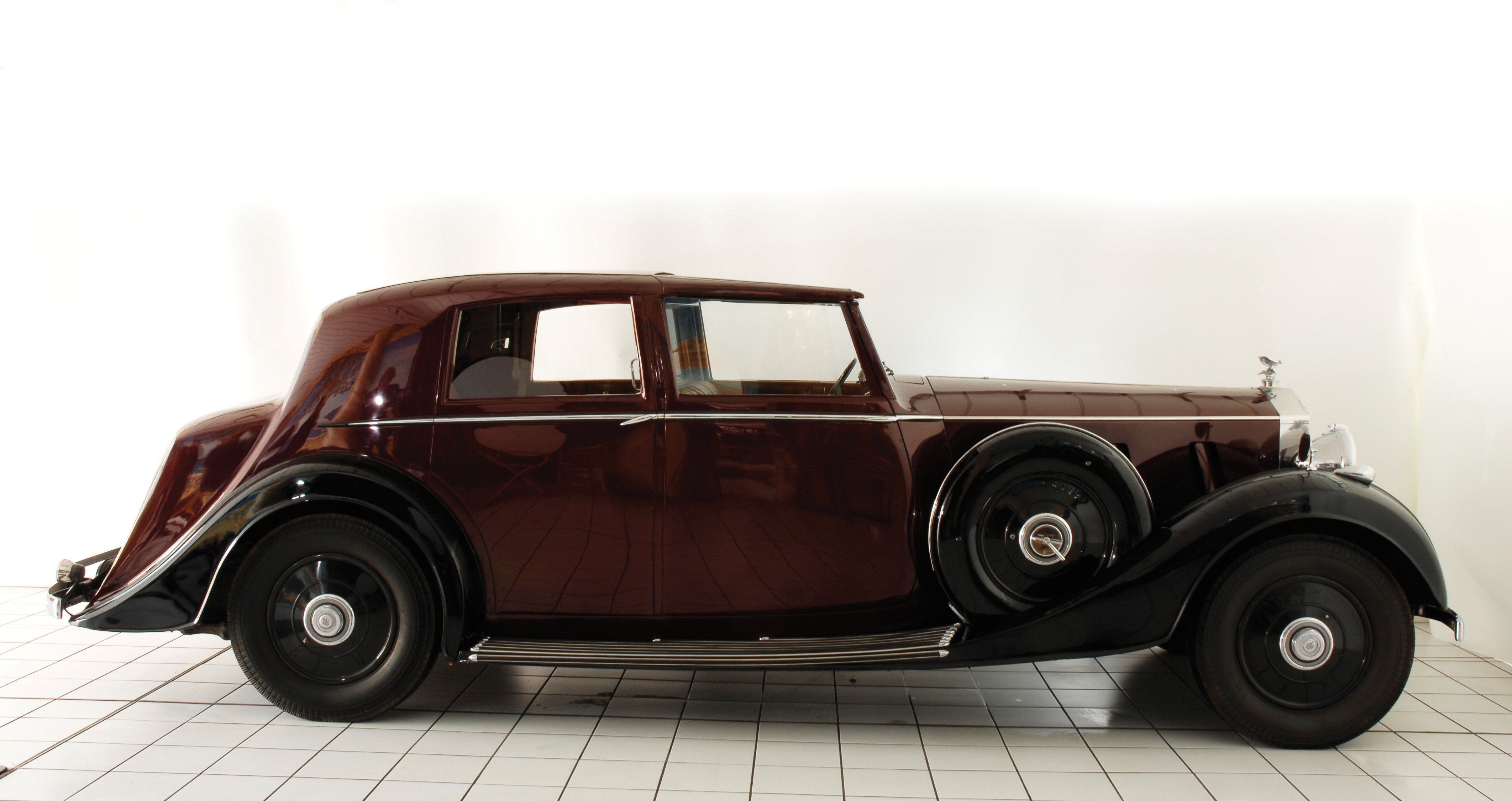 Classic maroon Rolls-Royce sedan