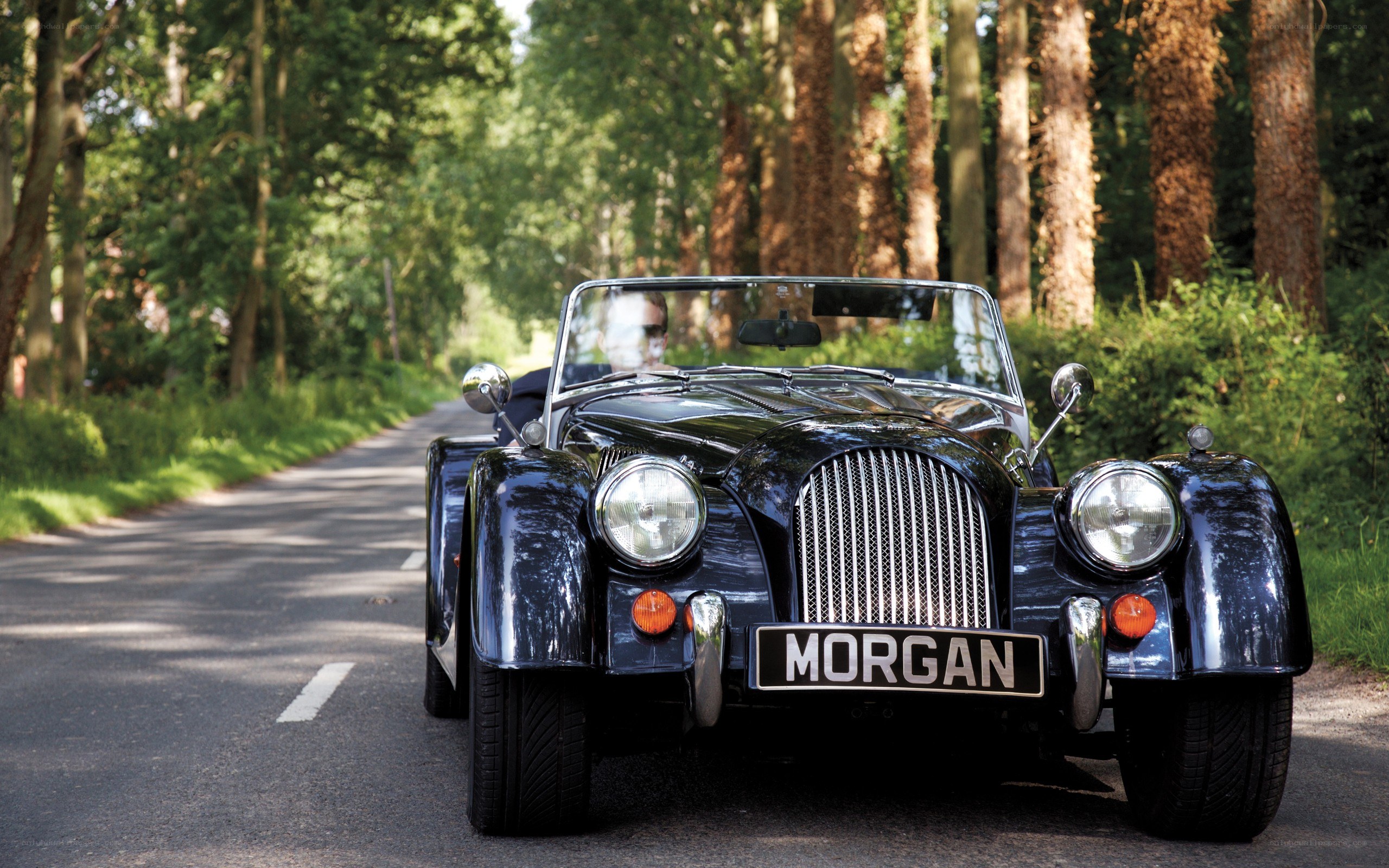 Classic Morgan car on a forest road