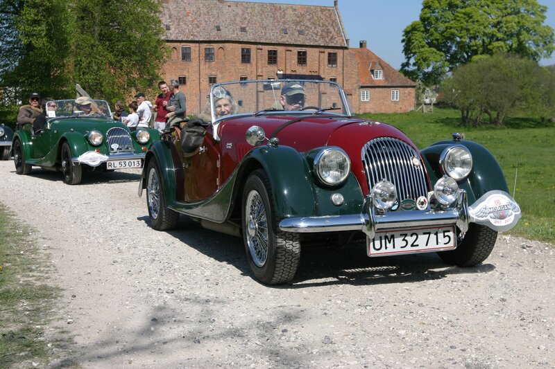 Classic Morgan cars on a gravel road