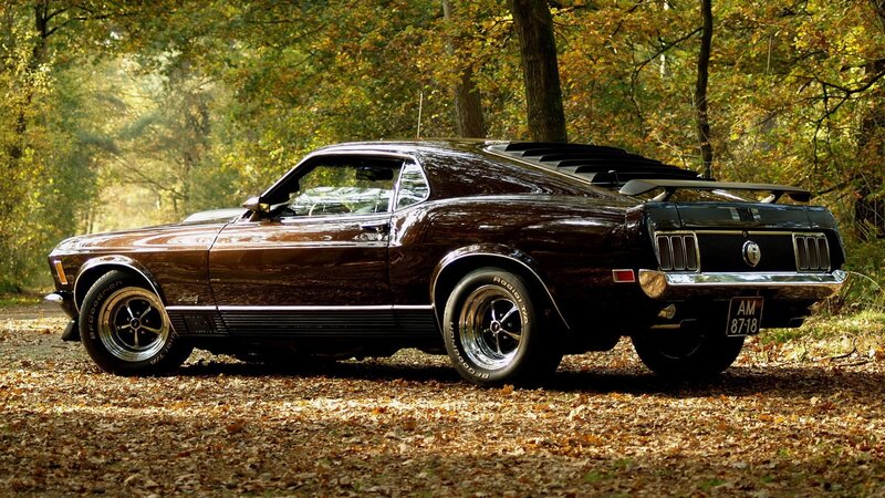 Classic muscle car in autumn forest