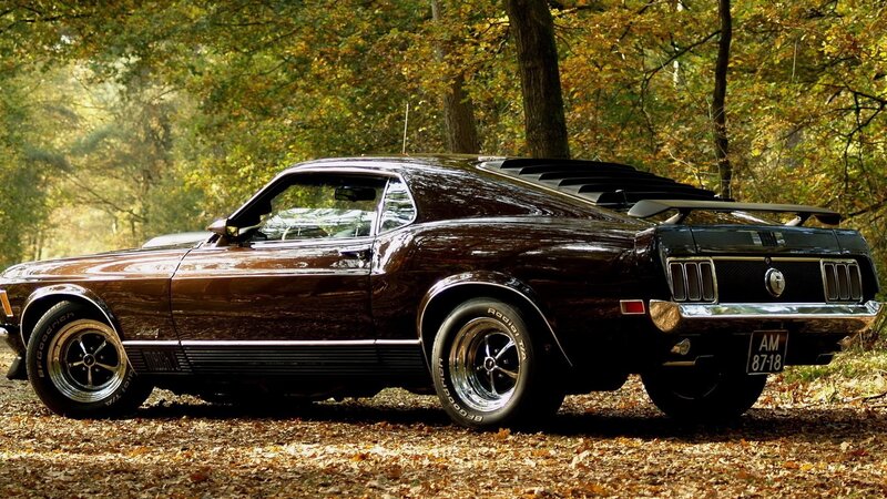Classic muscle car in autumn forest