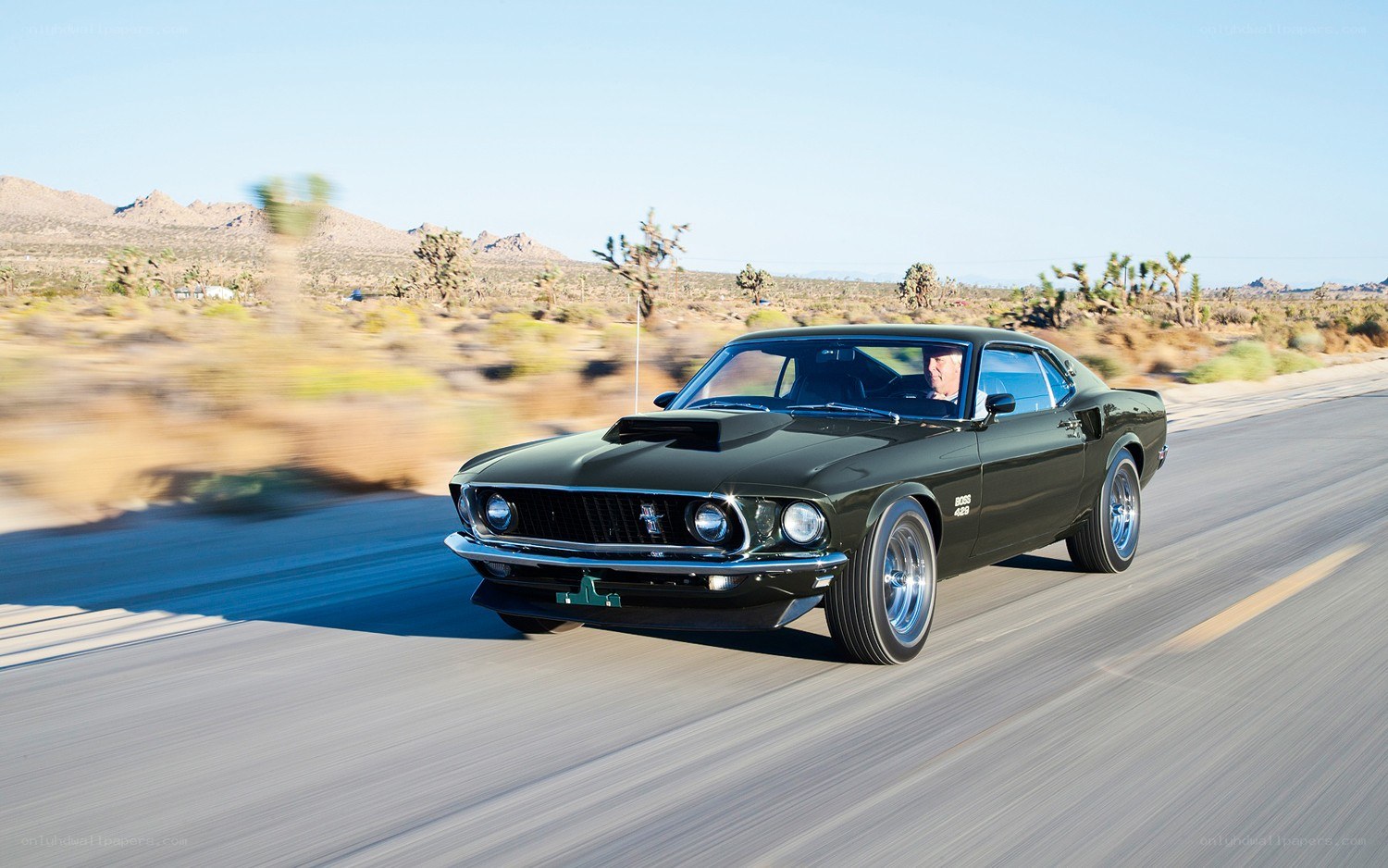 Classic muscle car on desert road
