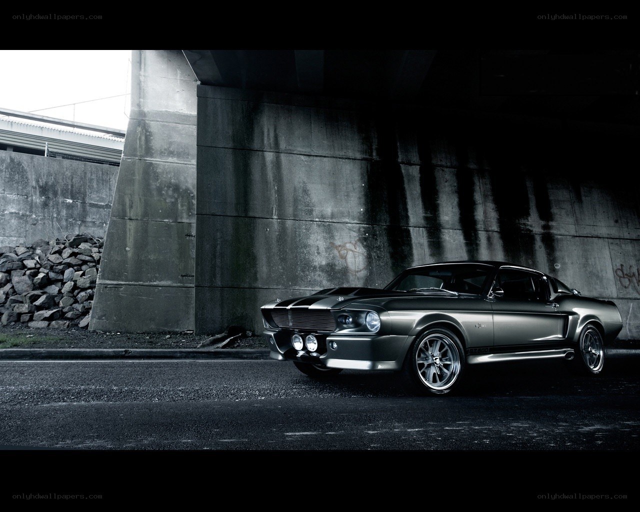 classic muscle car under bridge