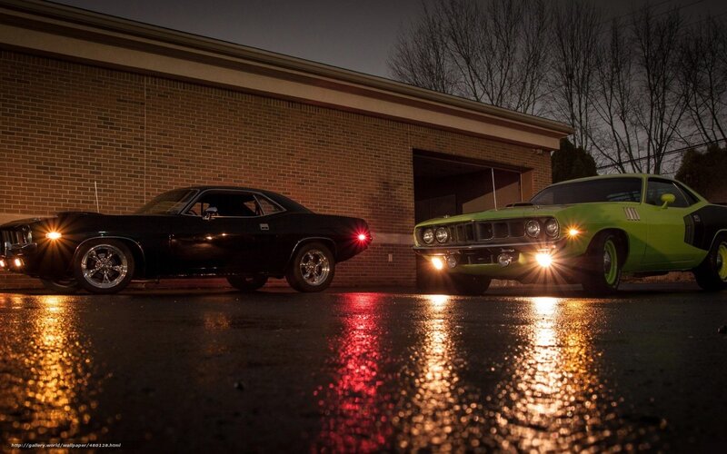 Classic muscle cars at night