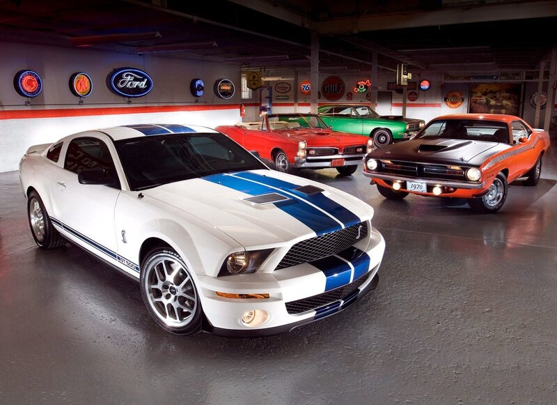 Classic muscle cars in garage