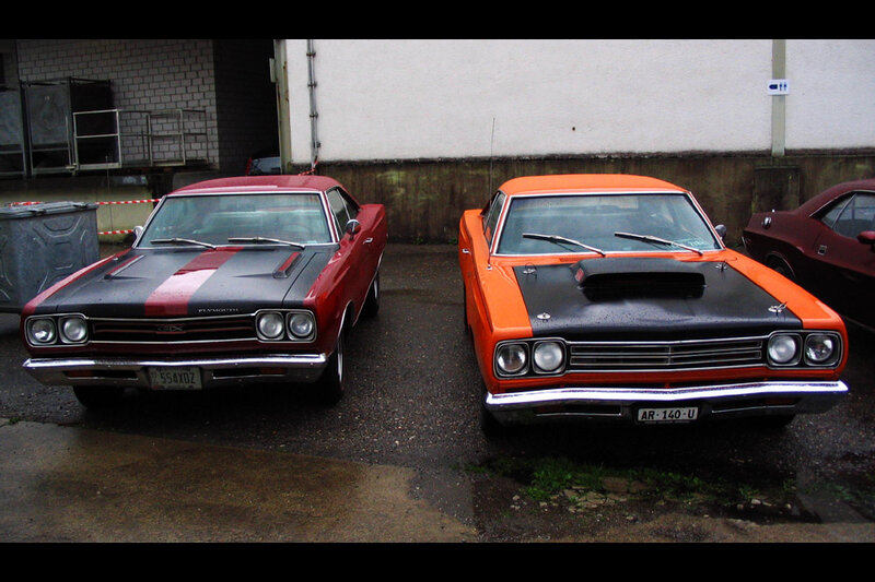 Classic muscle cars parked