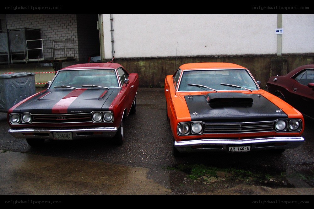 Classic muscle cars parked