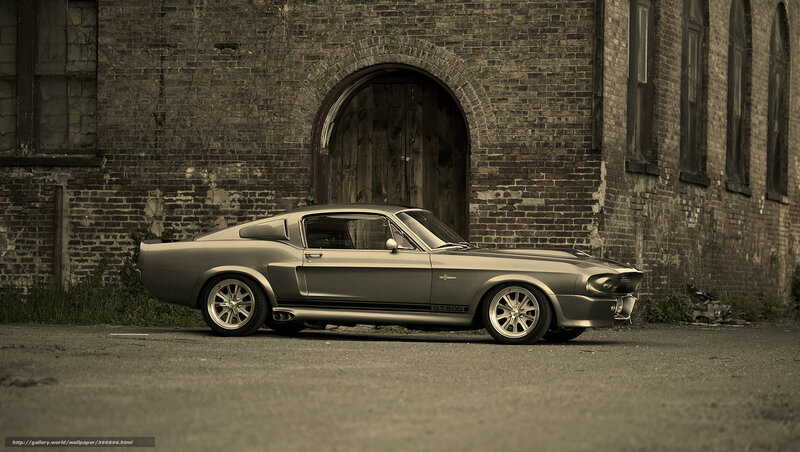 Classic Mustang in front of brick building