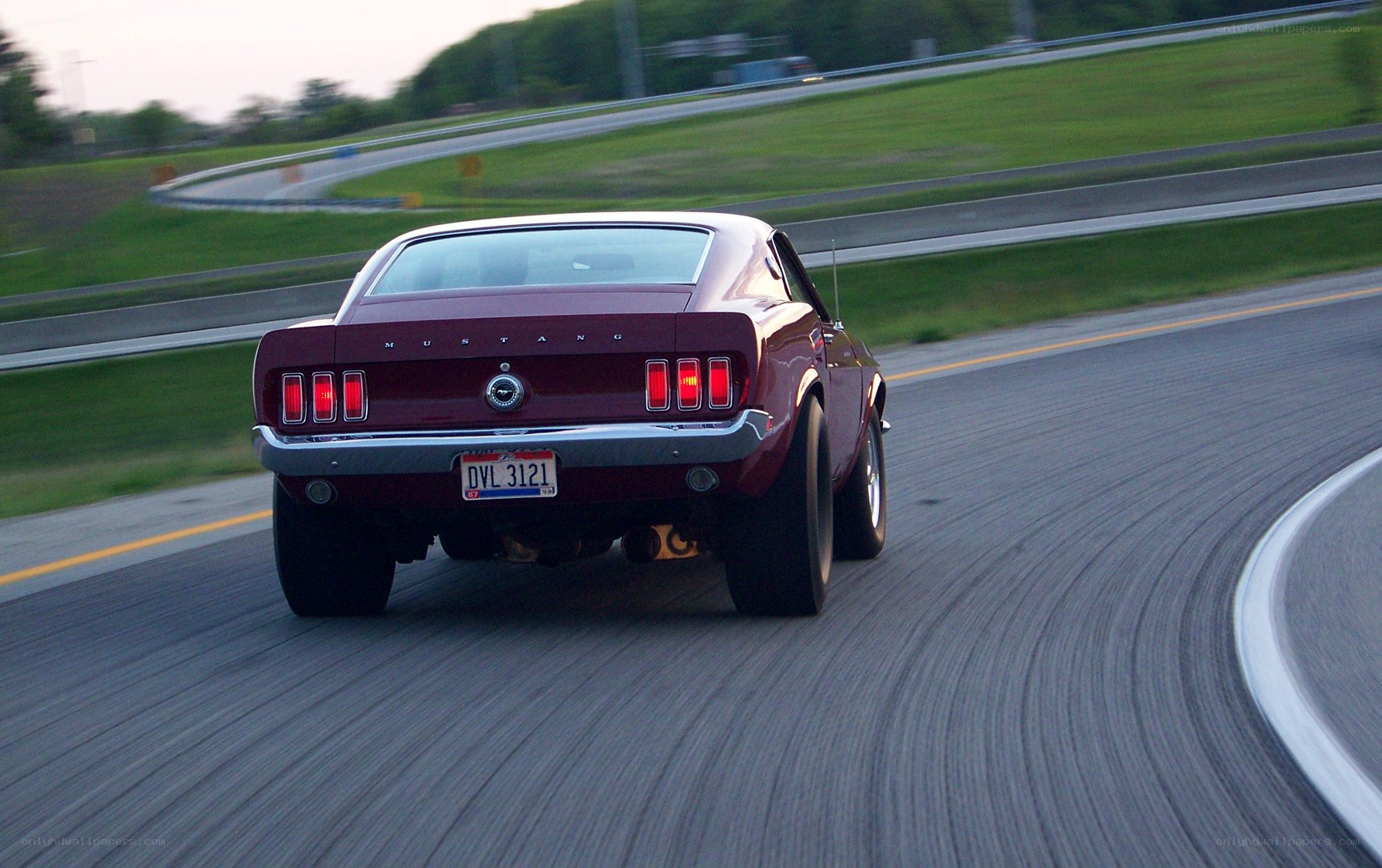 classic mustang on a winding road