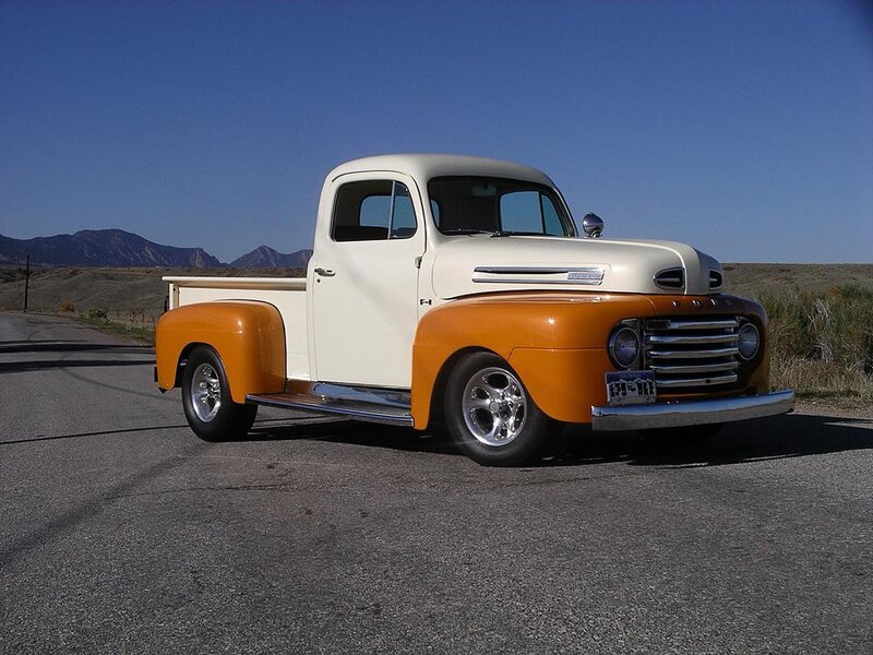 Classic orange and white pickup truck