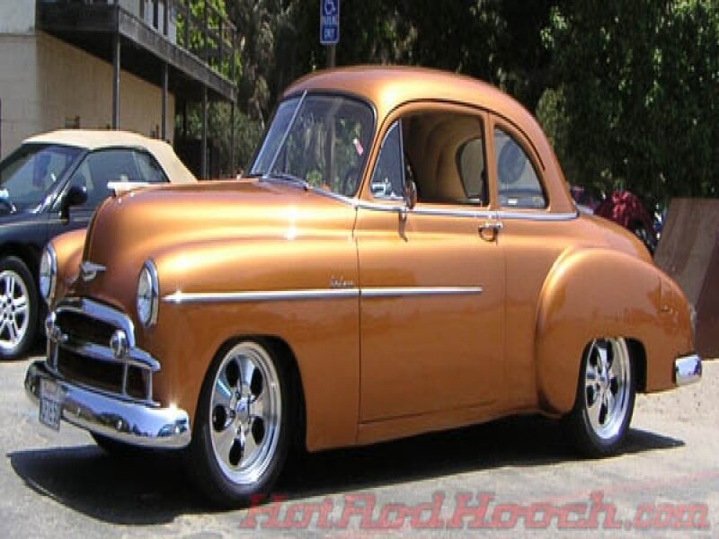 classic orange car at show