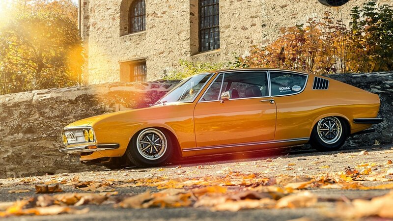 Classic orange car in autumn