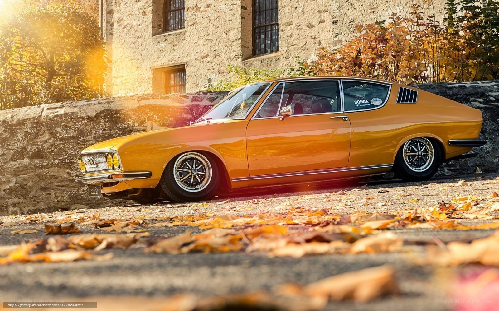Classic orange car in autumn