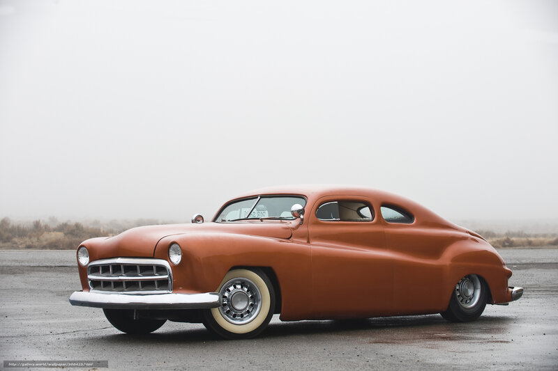 Classic Orange Car on a Foggy Day