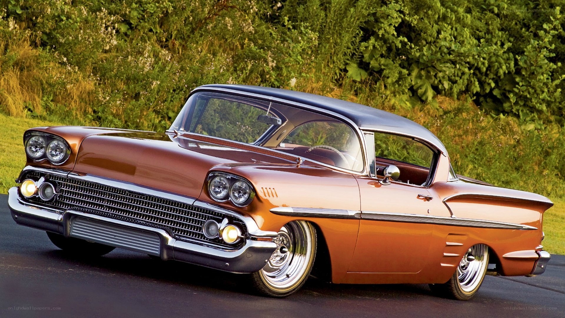 classic orange car on road