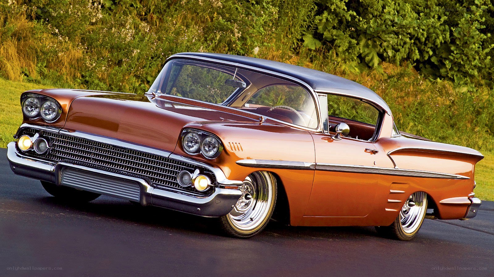classic orange car on road
