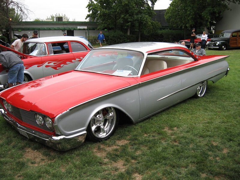 Classic red and silver car at a show