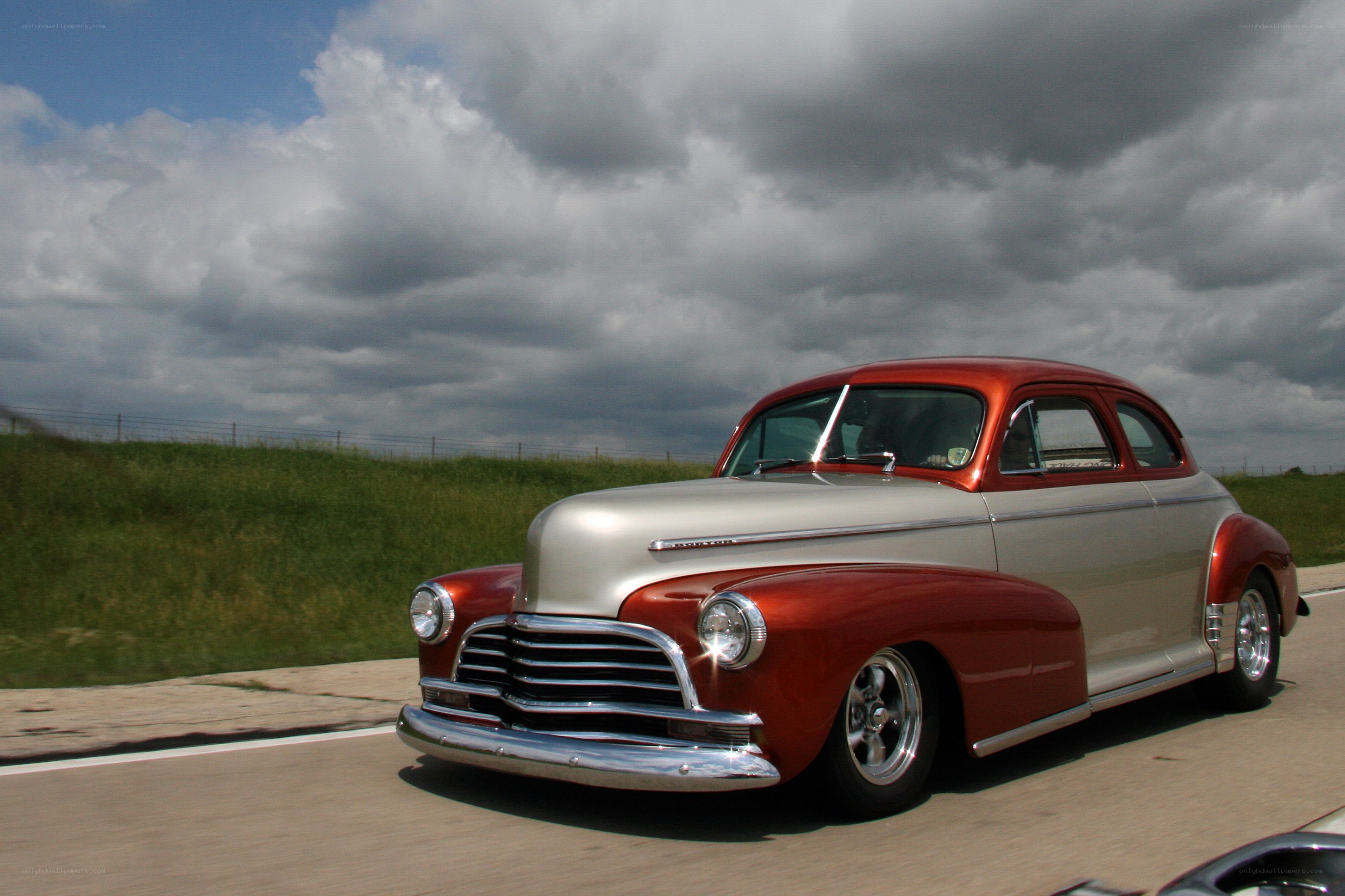 Classic red and silver car on road