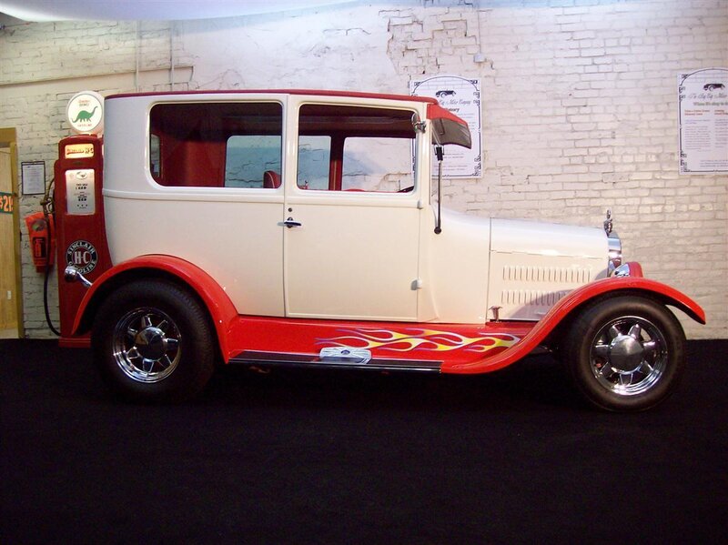 Classic red and white car with flames