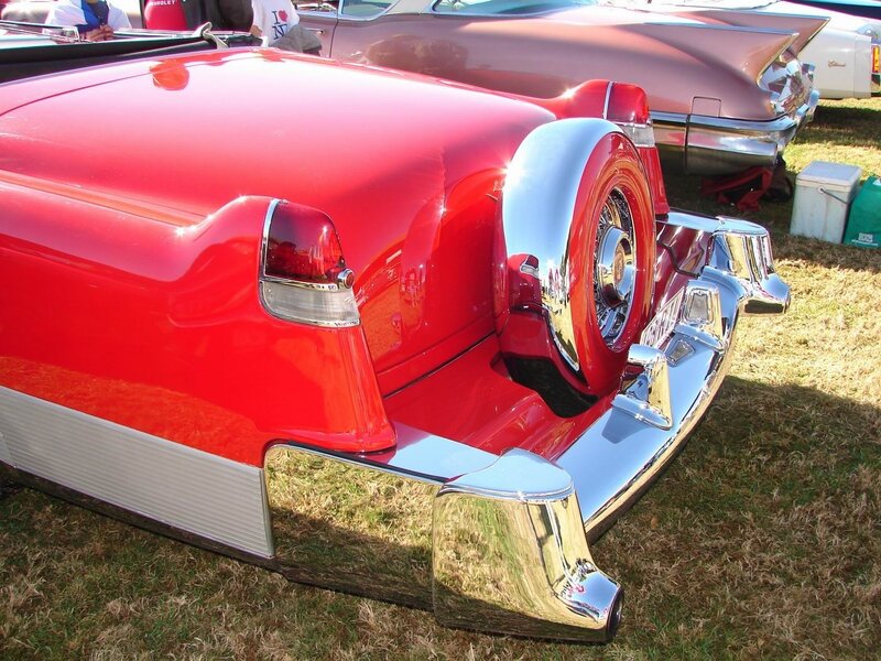 Classic red car with spare tire
