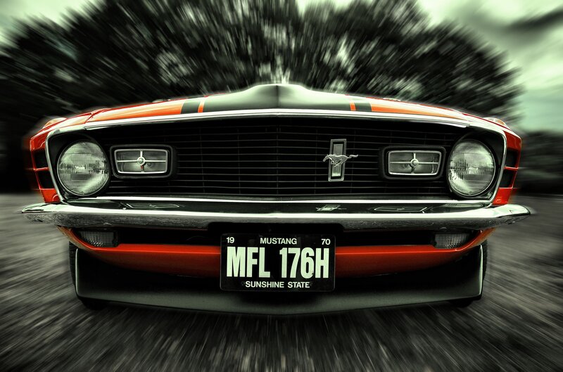 Classic red Mustang in motion