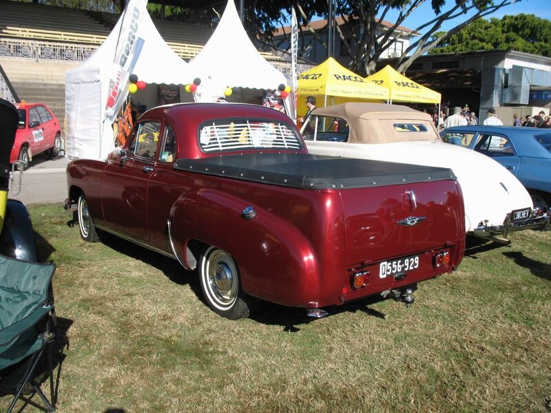 Classic red pickup truck at car show