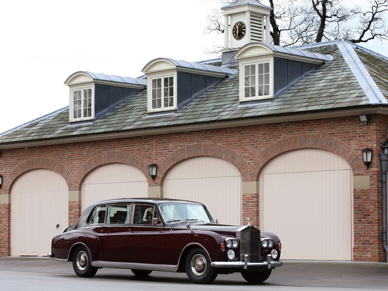 Classic Rolls-Royce in front of garage
